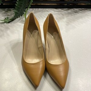 None West tan heels.